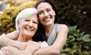 Happy senior woman spending quality time with her adult daughter outdoors