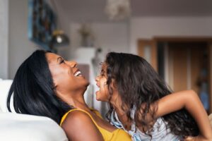 Happy family having fun at home.They are laughing. Multiethnic family concept