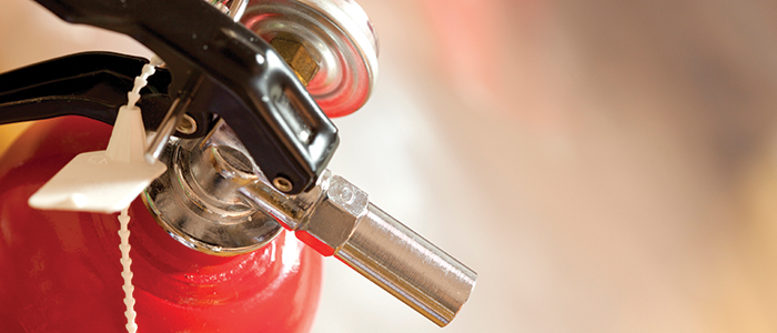 Close up of red fire extinguisher