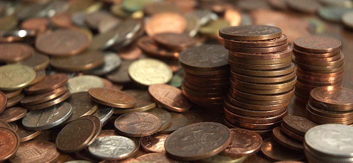 stacked pennies amidst a pile of coins