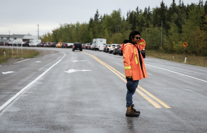 A volunteer directing traffic in Yellowknife