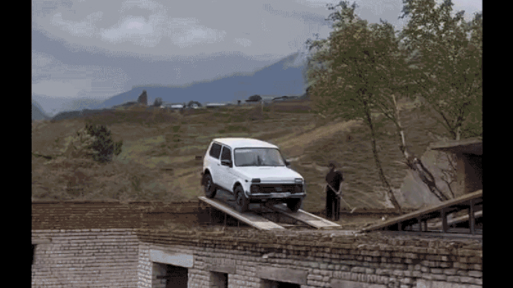 A Lada Niva Tries To Jump Across Rooftops And Fails Spectacularly