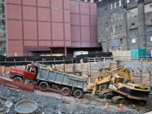 Construction site with heavy machinery and trucks