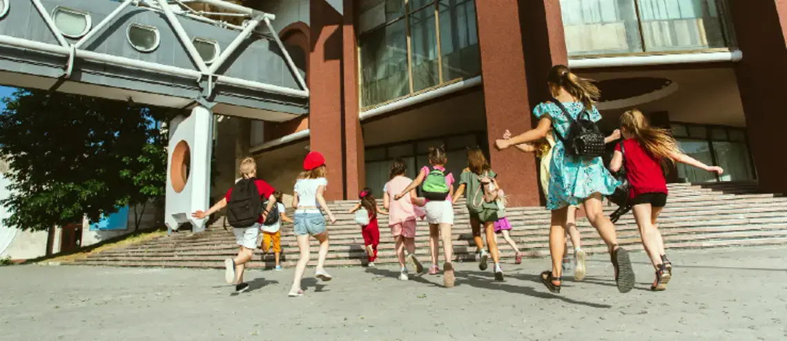 happy kids playing in school modern building