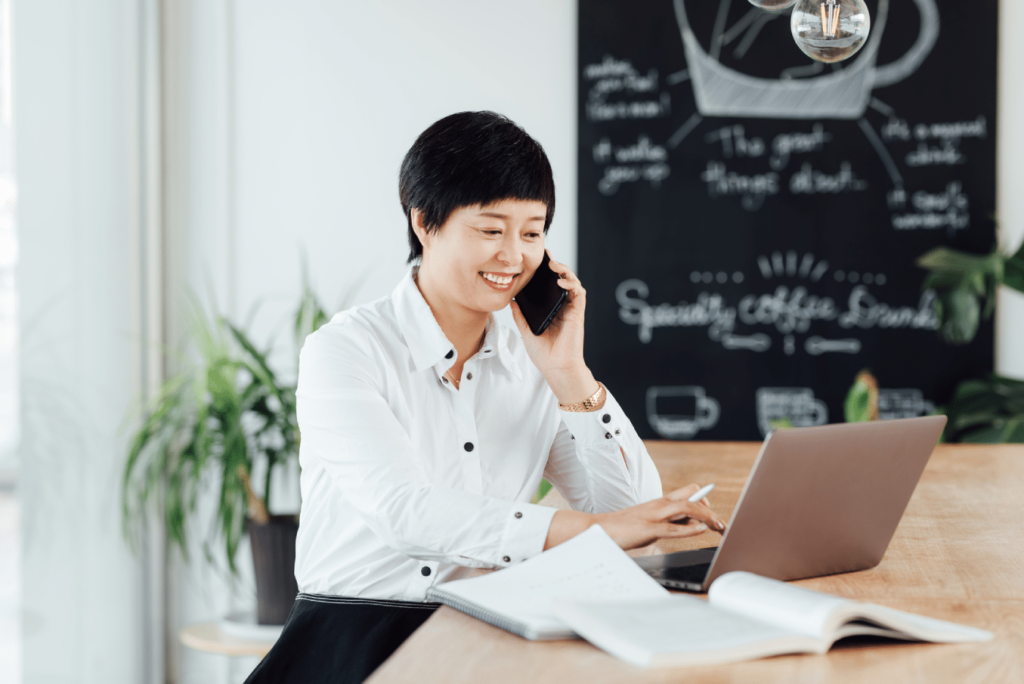 Young Asian business woman working in a beautiful coffee shop