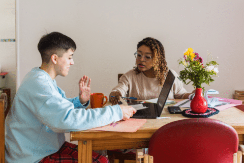 Interracial couple making desicions about their home finances, discussing options and payments.