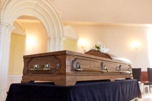 Wooden coffin on a dais for a funeral in a church