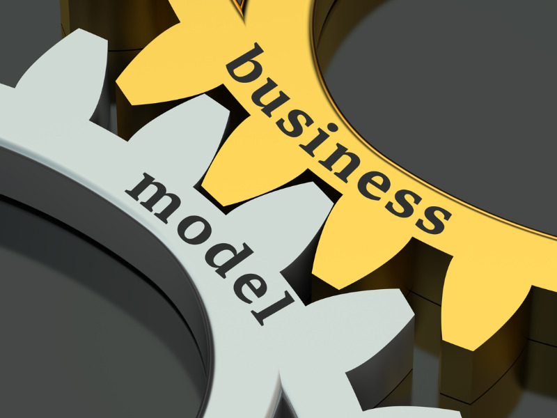 The words 'business model' with gears