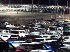 New vehicles at an auto dealership holding lot