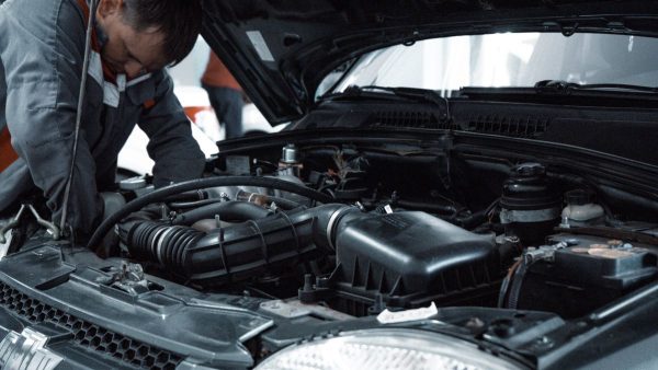 Mechanic working under the bonnet of car