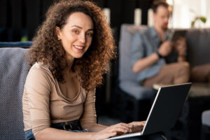 Woman using her laptop to look up ‘what is a guaranteed purchase option rider’