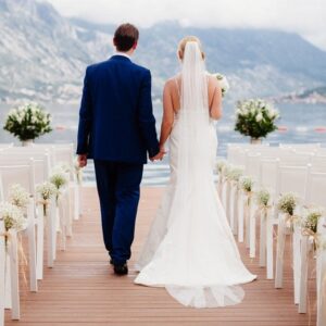 A bride and groom walking down the aisle