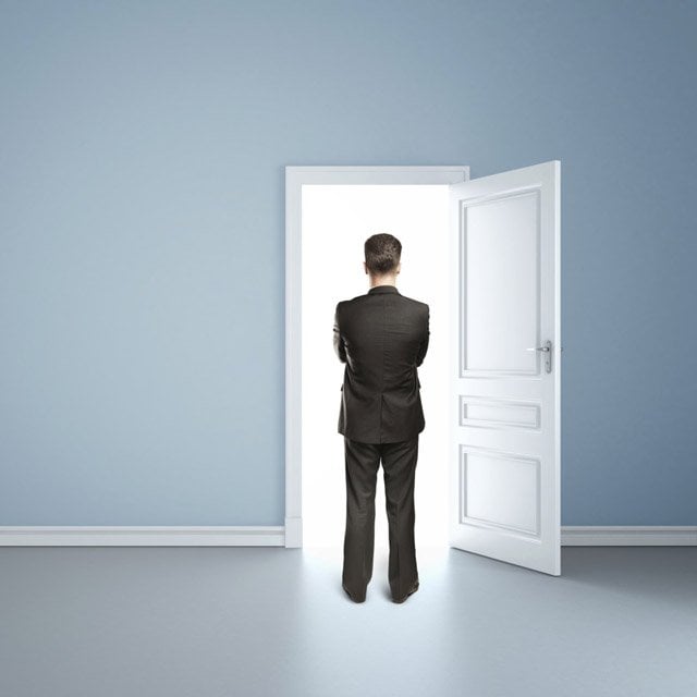 Businessman standing in a doorway