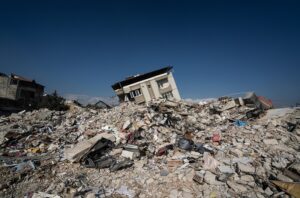 The wreckage of a collapsed building after an earthquake NatCat