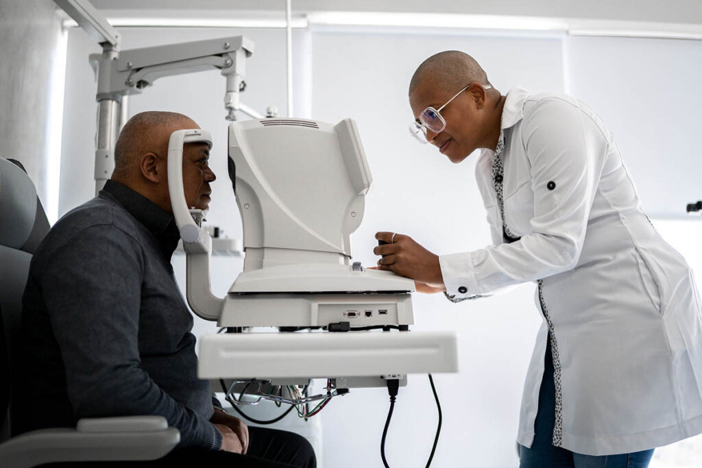 Ophthalmologist examining patient's eyes