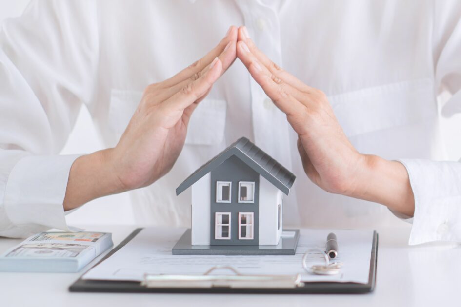 hands over a home covering it, What are the Different Types of Home Insurance?, GasanMamo