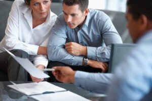 Portrait of an agent consulting a mature couple at office