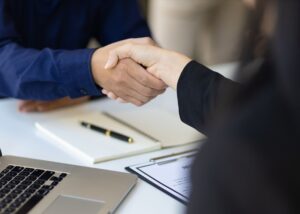 Business acquisition sealed with a handshake