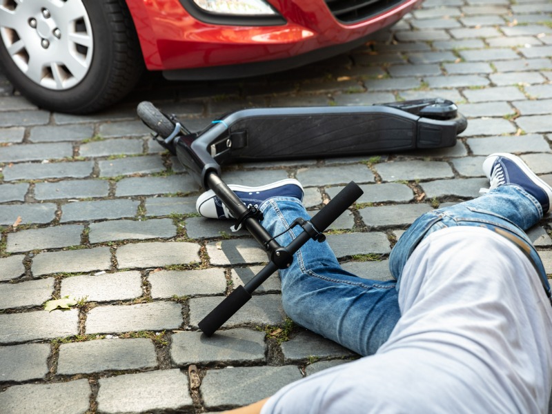 Accident between an e-scooter and a car.