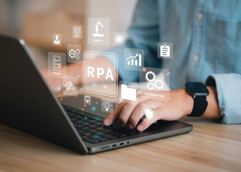 Businessman using a computer and dashboard RPA