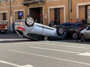 Expensive car wrecked on a street