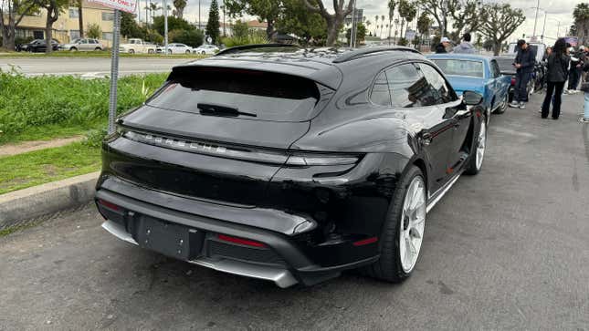 Rear 3/4 view of a black Porsche Taycan Cross Turismo