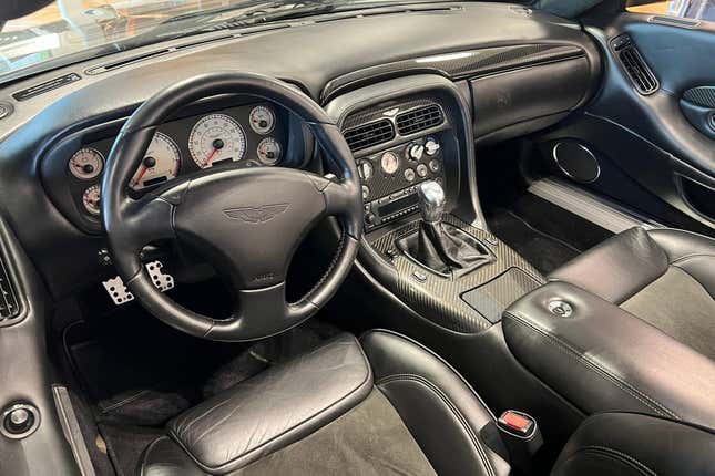 A shot of the interior of the car showing off the charcoal leather and alcantara and the solid metal shifter