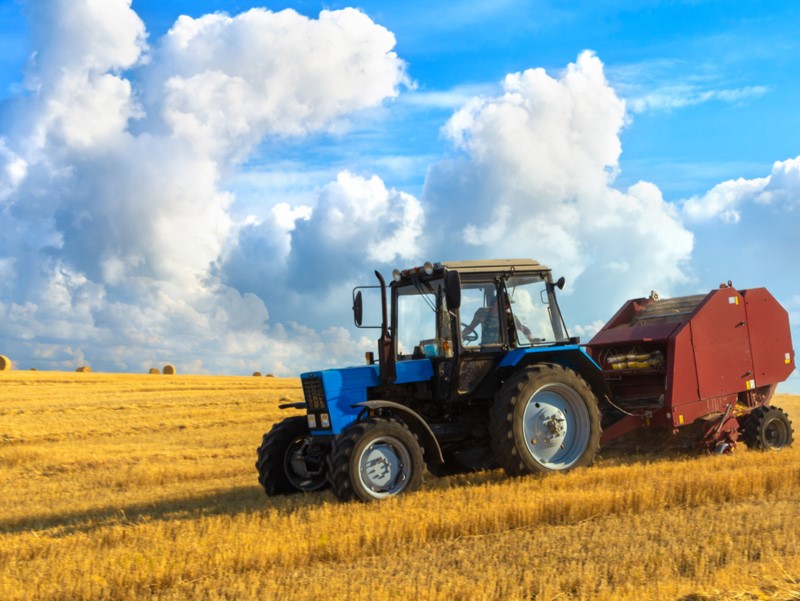 Tractor bringing in the hay