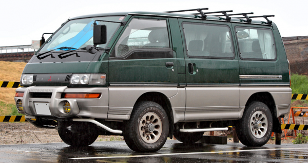 Mitsubishi Delicia parked outside in the rain