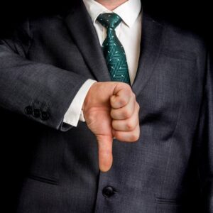 Businessman thumbs down