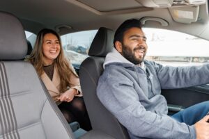 Car driver and passenger enjoy a new, made-in-Maritime rideshare program has been launched