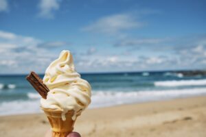 melting Ice cream at Fistral beach, Newquay, Cornwall on a bright sunny June day.