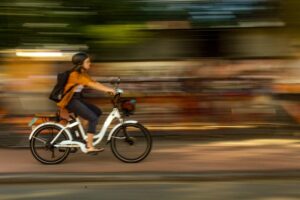 E-bike riding on the road with a blurry background