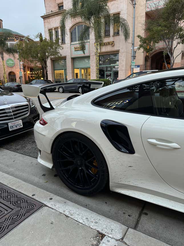 Rear quarter panel of a white Porsche 911 GT2 RS