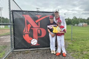 Erin Thurston and her sons at the Little League park, with the portable AED