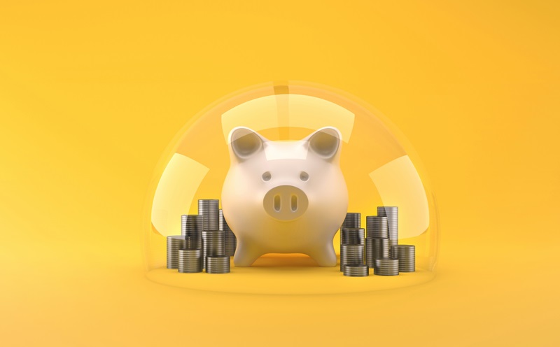 Front view of a piggybank over yellow background