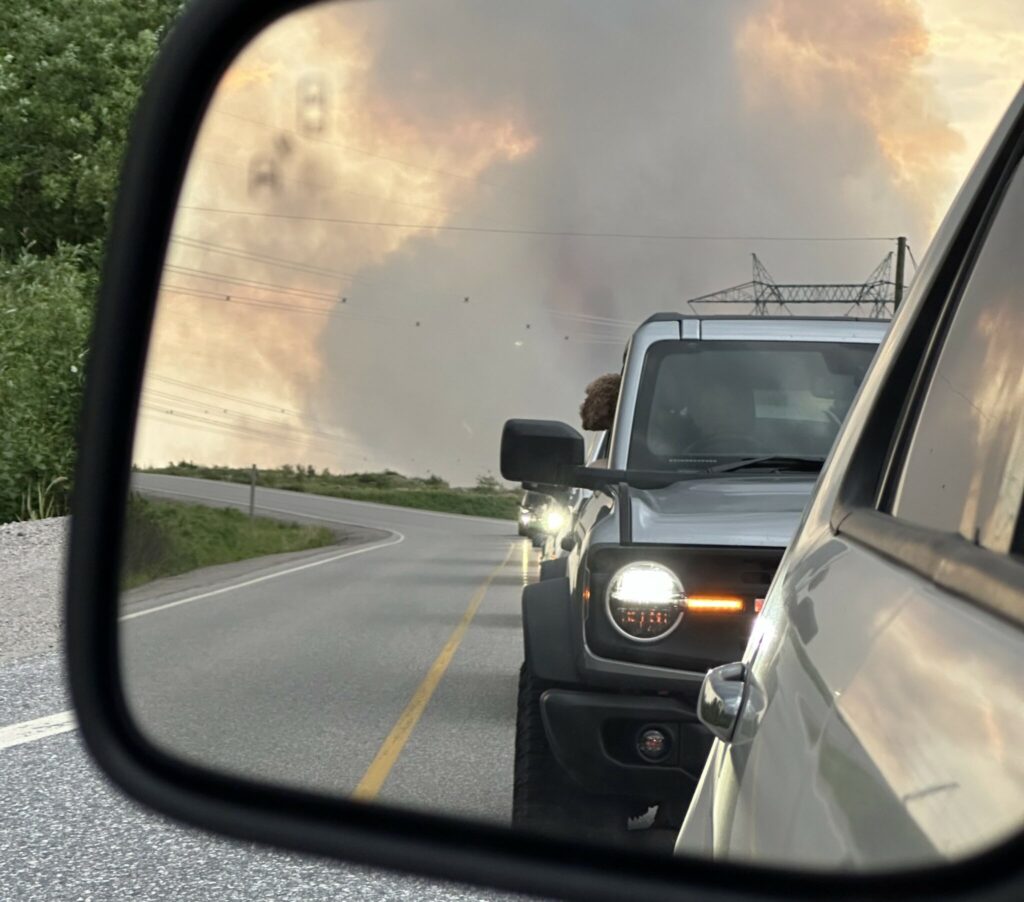 Vehicles leave Churchill Falls, N.L. under a threat of a wildfire in a Wednesday, June 19, 2024 handout photo. THE CANADIAN PRESS/HO-Robert Dawe **MANDATORY CREDIT** Robert Dawe