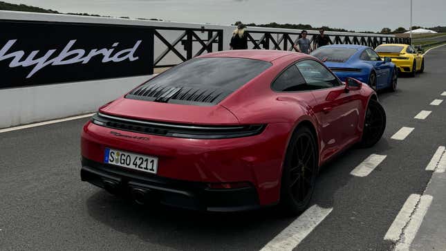 Front 3/4 view of a blue 2025 Porsche 911 Carrera