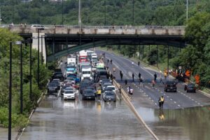 Drivers are stranded due to flood waters blocking the Don Valley Parkway following heavy rain in Toronto, on Tuesday, July 16 2024. THE CANADIAN PRESS/Arlyn McAdorey