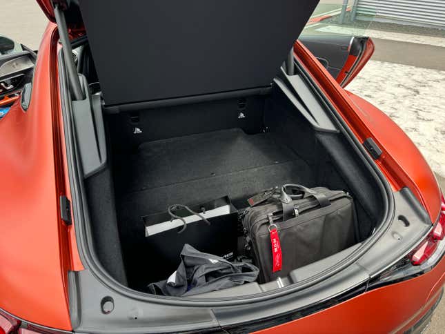 Cargo area of a matte orange 2025 Mercedes-AMG GT63 S E Performance