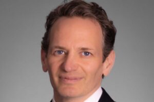 AIG names Adam Burk Global Treasurer and Head of Corporate Development