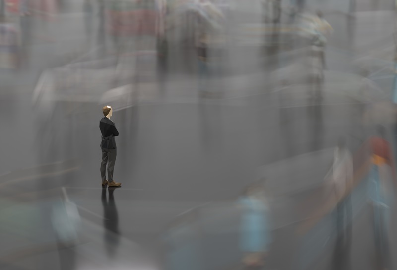 LowPoly man standing against crowd motion blur, 3D generated image.