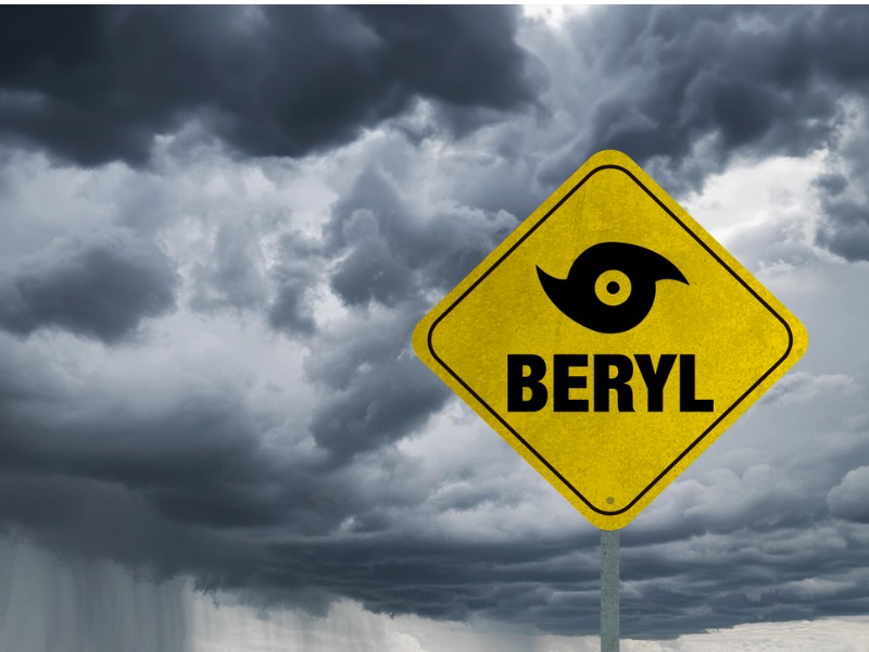 Hurricane Beryl road sign with storm clouds in background