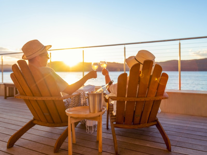 Retired couple drinking wine.