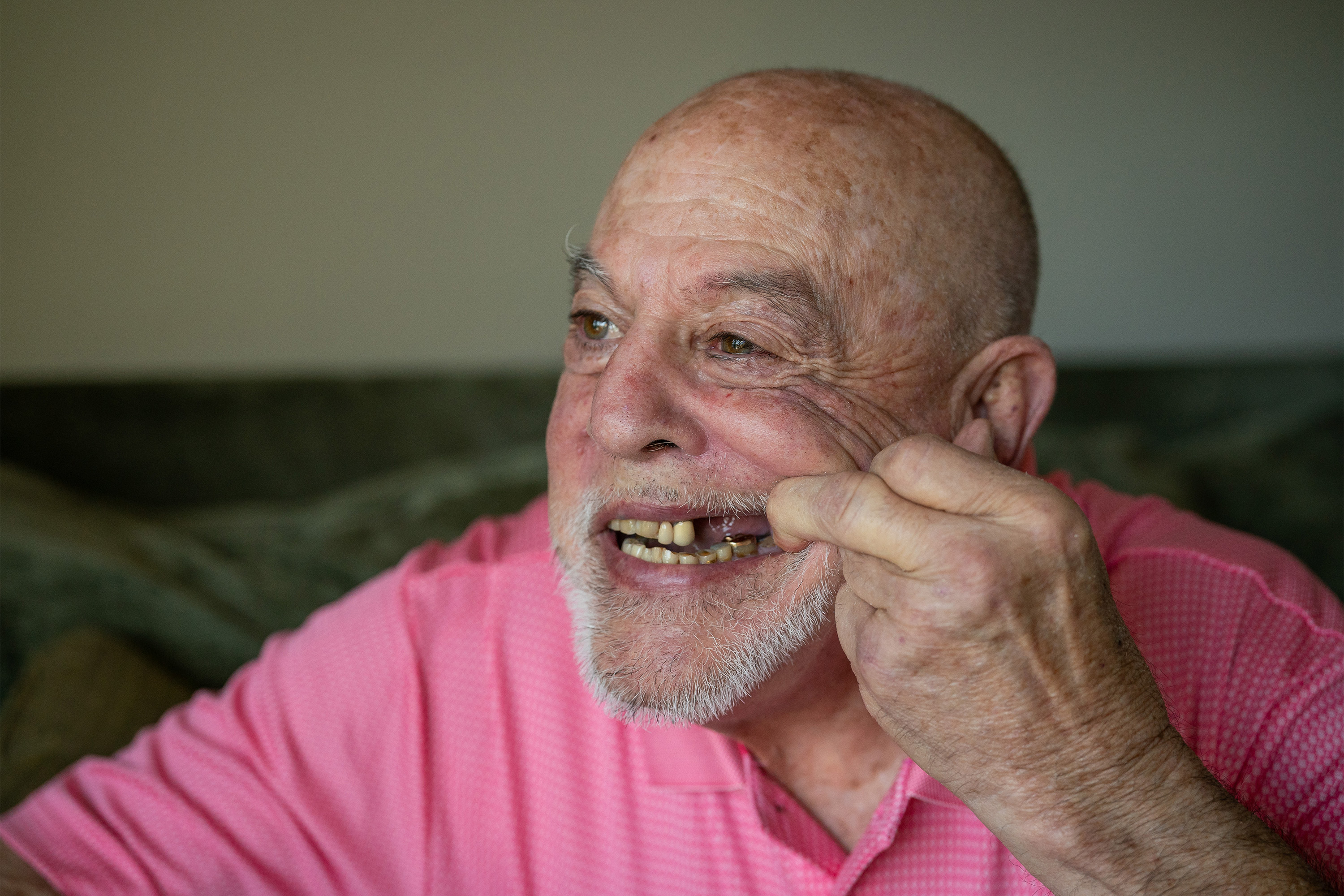 A photo of Bobby Moske pulling his mouth open to show the gap in his smile.