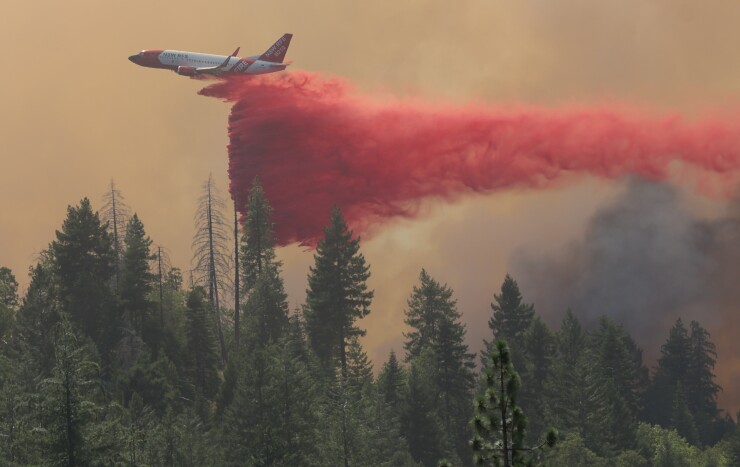 Aircraft drops fire retardnant on the Park Fire in northern California.