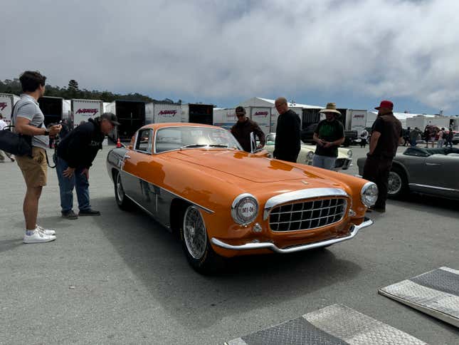 Front 3/4 view of an orange and grey 1954 Ferrari 375 MM Ghia Coupe