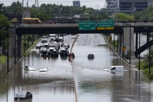 Cars are partially submerged in flood waters in the Don Valley following heavy rain in Toronto on July 16 2024. THE CANADIAN PRESS/Arlyn McAdorey