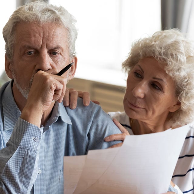 Worried senior couple