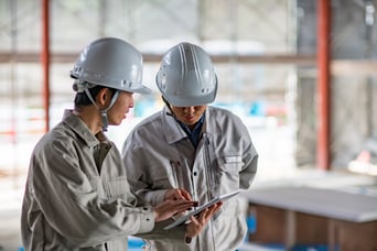 Two construction workers.